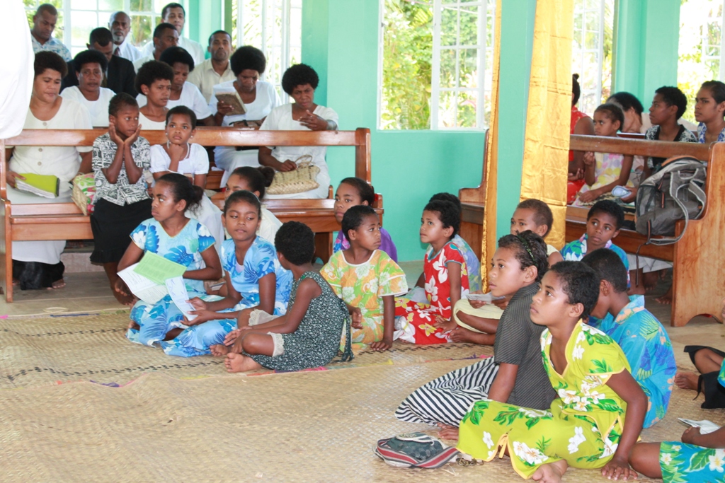 Fiji and South Pacific celebrate the launch of the books of James and Mark, also the Abraham comics, in Maumi, in June 2012. The children at the service celebrating the new translations. (project 86413)